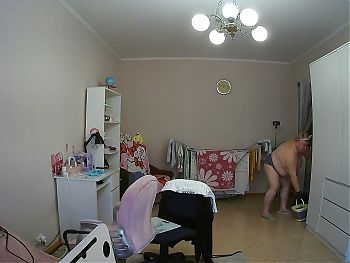 mother-in-law cleans the room naked