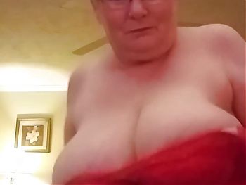 Hot Granny Plays With Her Giant Boobs Trying To Entice You